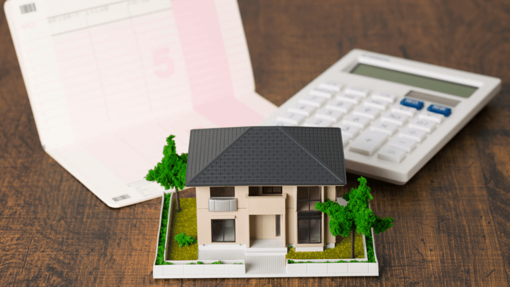 家の模型と通帳